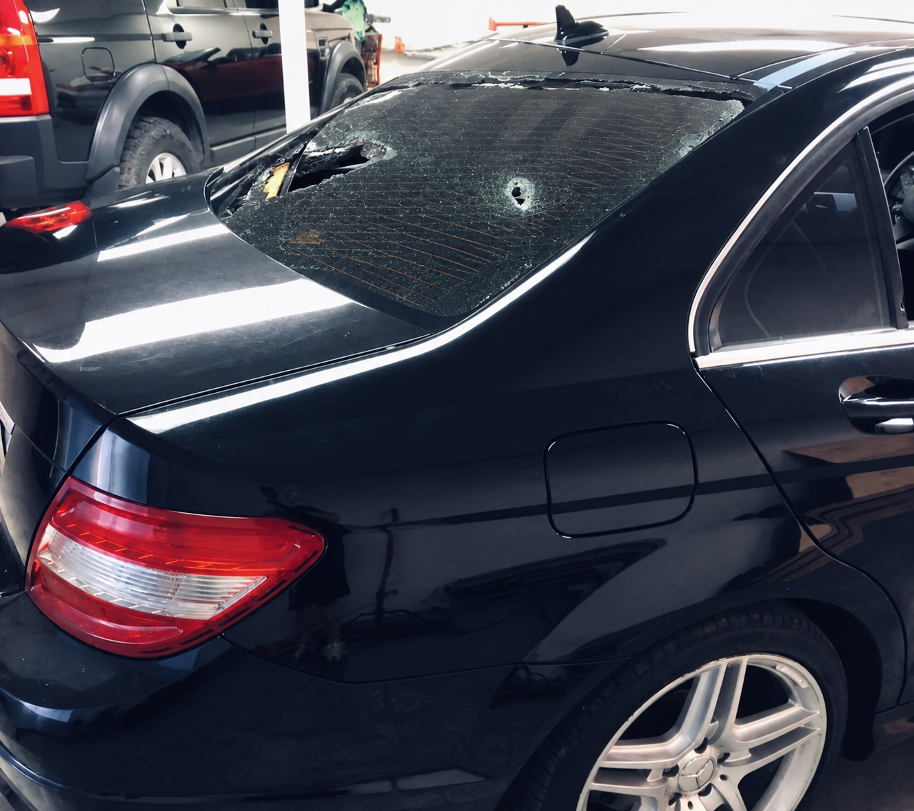 Before: damaged shattered rear windshield